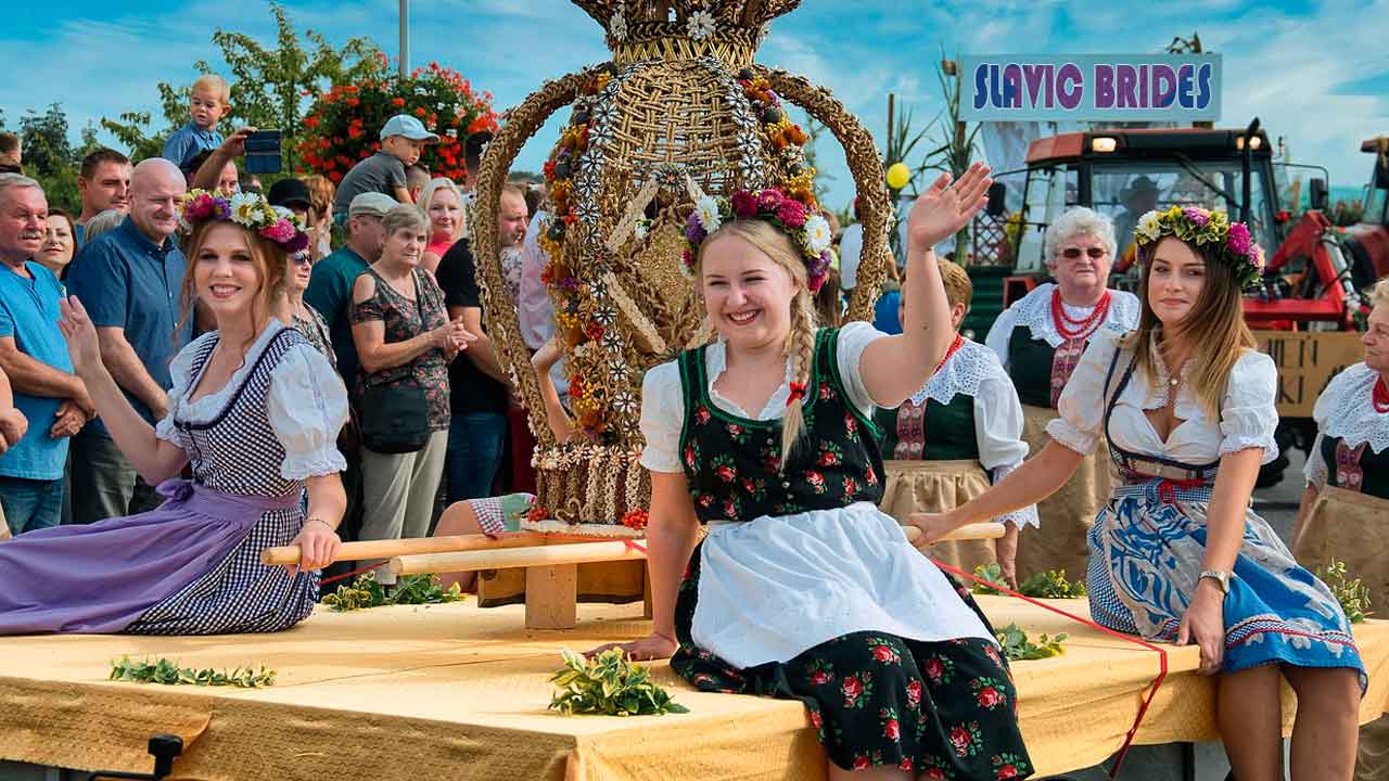 A beautiful Eastern European woman with blonde hair smiling, representing Slavic brides.